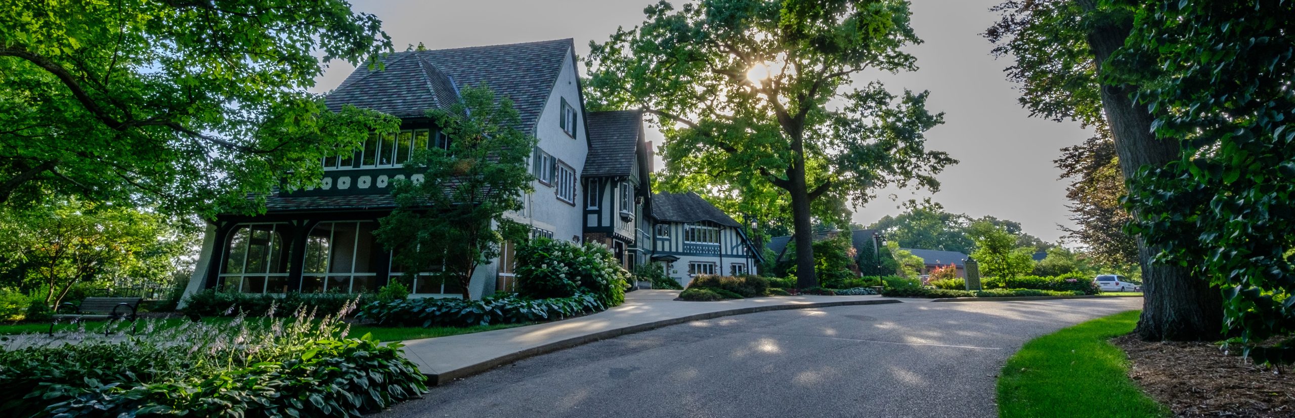 The W.K. Kellogg Manor House, a 1920s-era Tudor-style mansion, faces Gull Lake in the summer months.