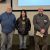 From left, Kevin Kahmark, Sierra Amyx, and Daniel Gorentz stand in the KBS Auditorium after being named Employees of the Year for 2024.